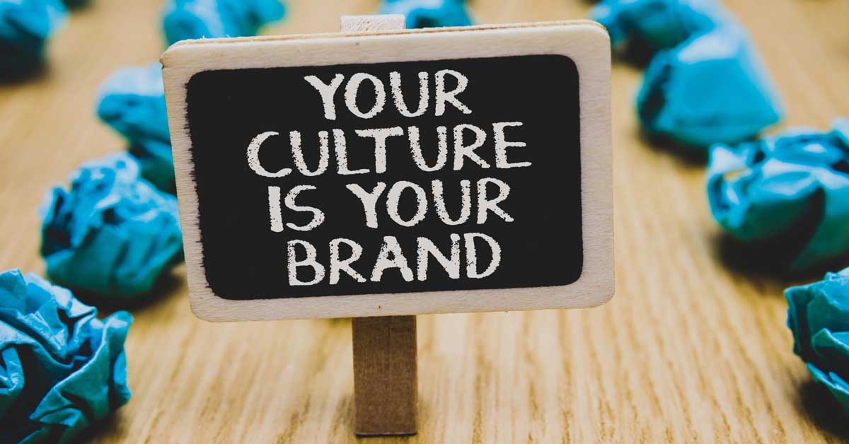 A chalkboard sign saying Your culture is your brand